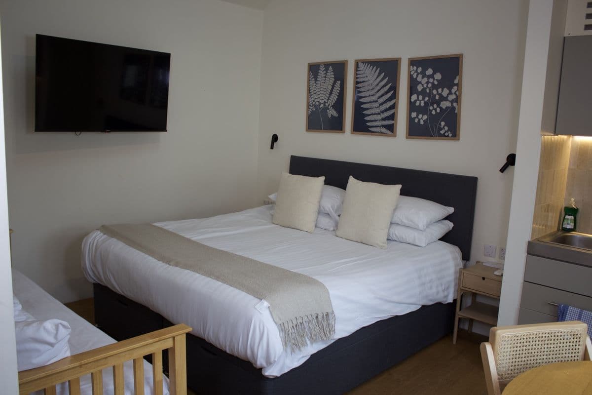 A made-up double room in the Stables